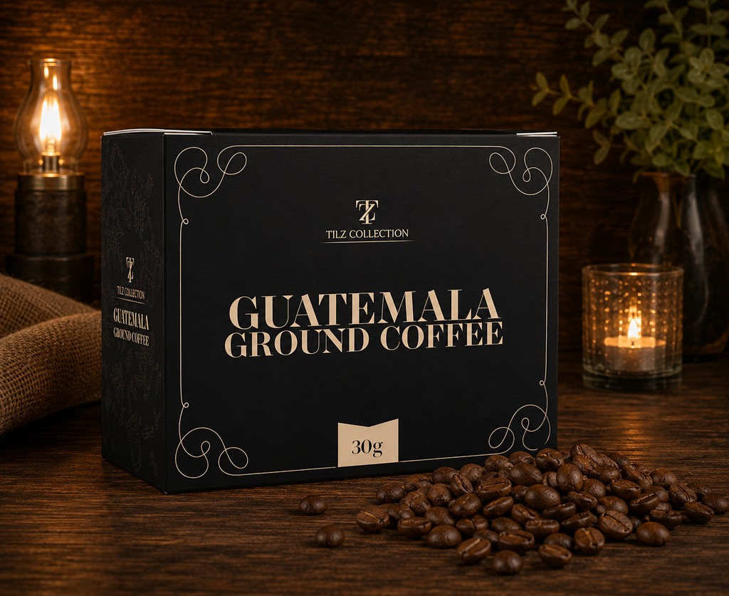 Tilz Collection Guatemala Ground Coffee 30g box on rustic wooden surface with roasted coffee beans oil lamp and candle