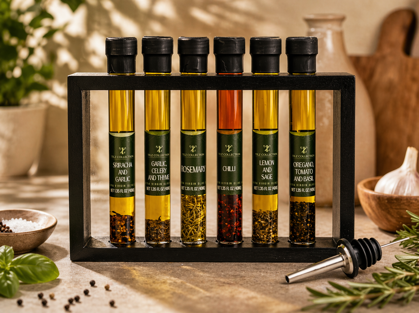 Tilz Collection Infused Oil Gift Set 6 gourmet cooking oils and balsamic blends in wooden display rack with pourer fresh basil garlic and peppercorns on rustic surface