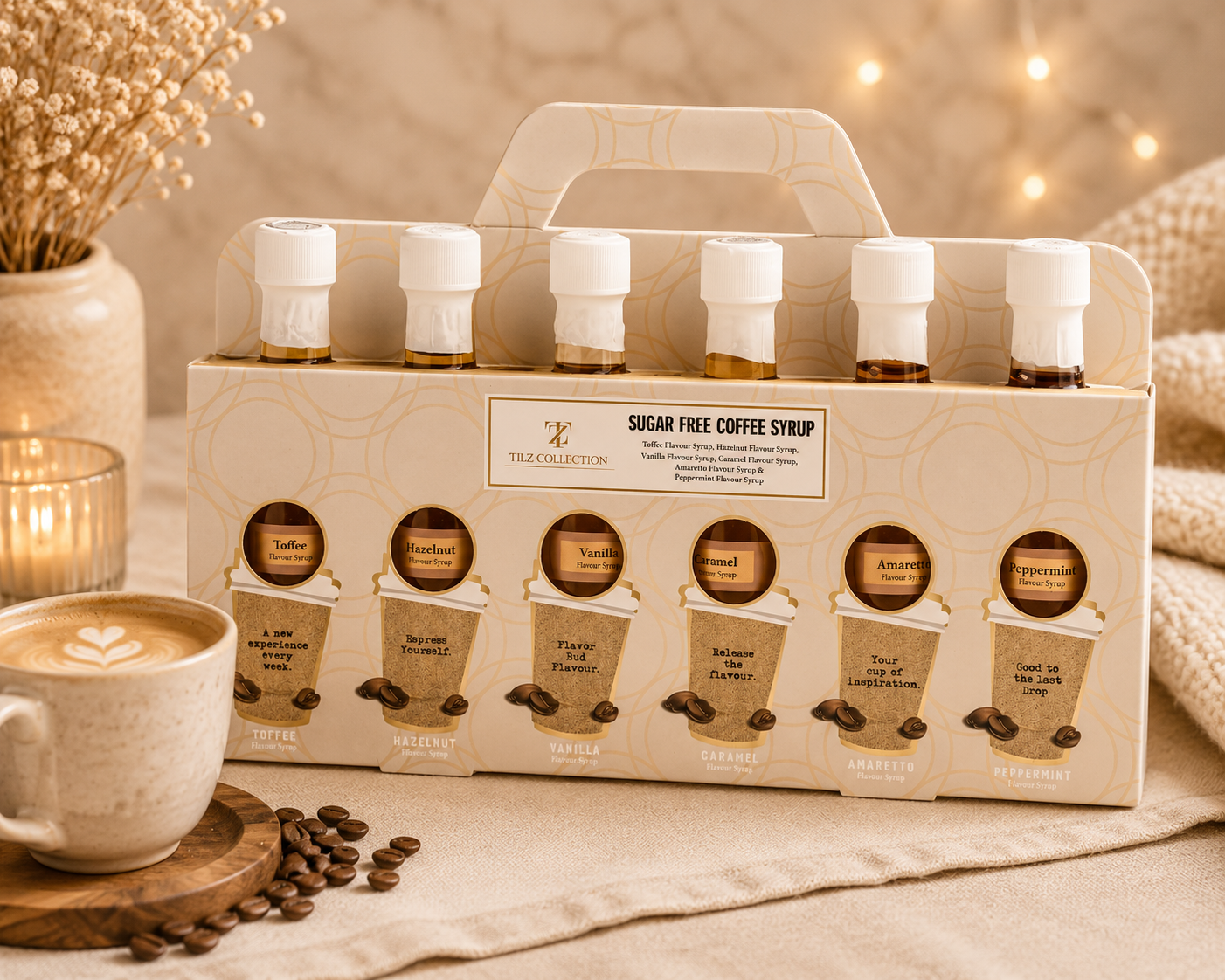 Tilz Collection Sugar Free Coffee Syrup Gift Set front view 6 cafe flavour bottles in decorative carrier box with latte coffee cup and roasted coffee beans on marble surface